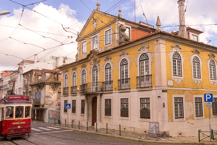 Tram Lapa and yellow house in Lisbon
