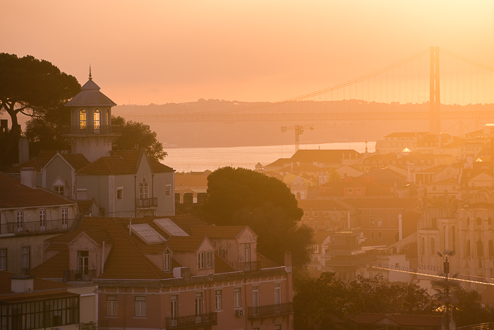 Lisbon tower and bridge on sunset